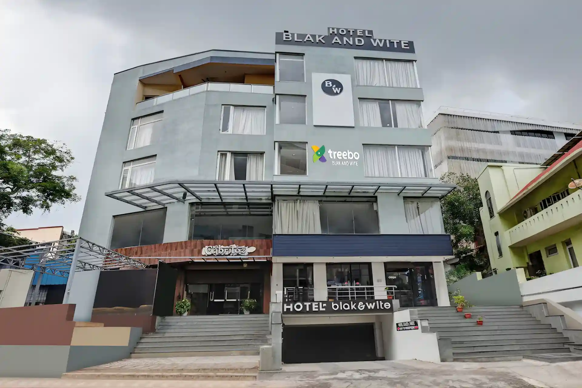 Hotel Black and White Vizag exterior view with entry gate near RK Beach.