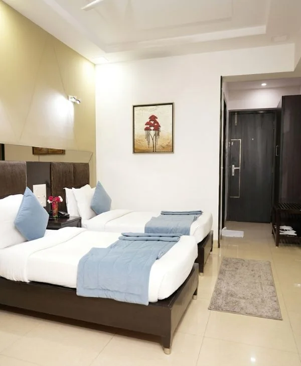 Clean and comfortable hotel room interior showcasing Vizag hotel services